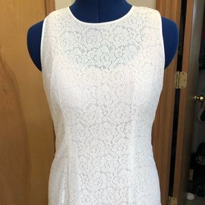 Cream lace sleeveless blouse.